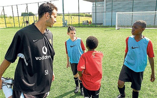 Waiting in the wings: Ryan Giggs with Danny Welbeck (far right) at 13 