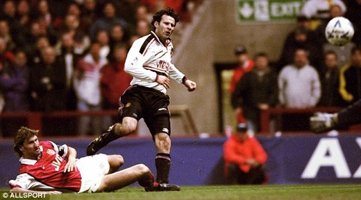 Ryan Giggs avoids Tony Adams' tackle to score for United against Arsenal 