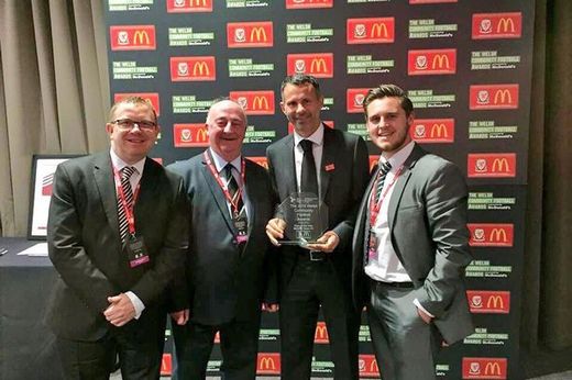 Merthyr Town FC receive their Community Club of the Year Award from Ryan Giggs